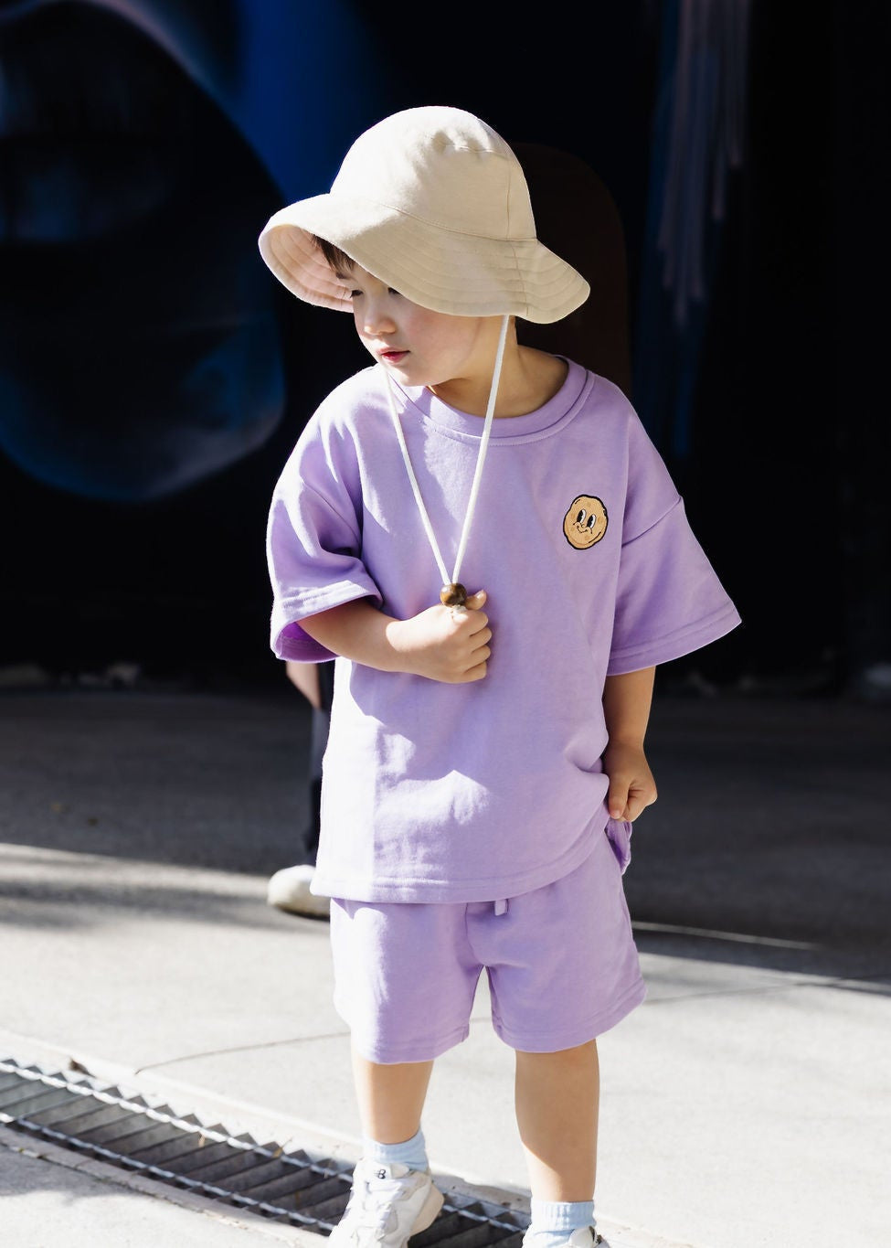 Kid wearing Crumb outdoors in summer