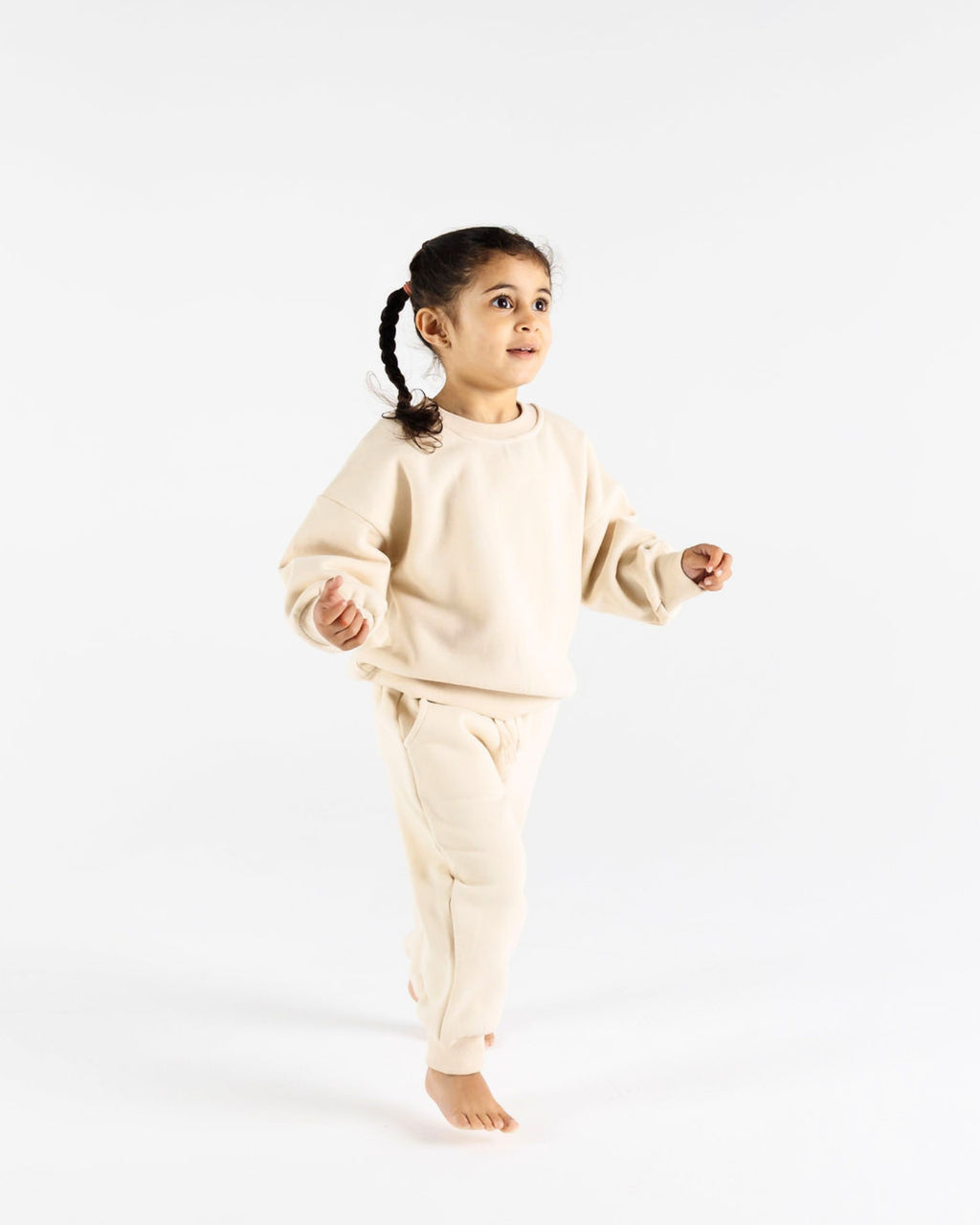 Happy girl in Crumb's Downtown Set - Milk White kids tracksuit