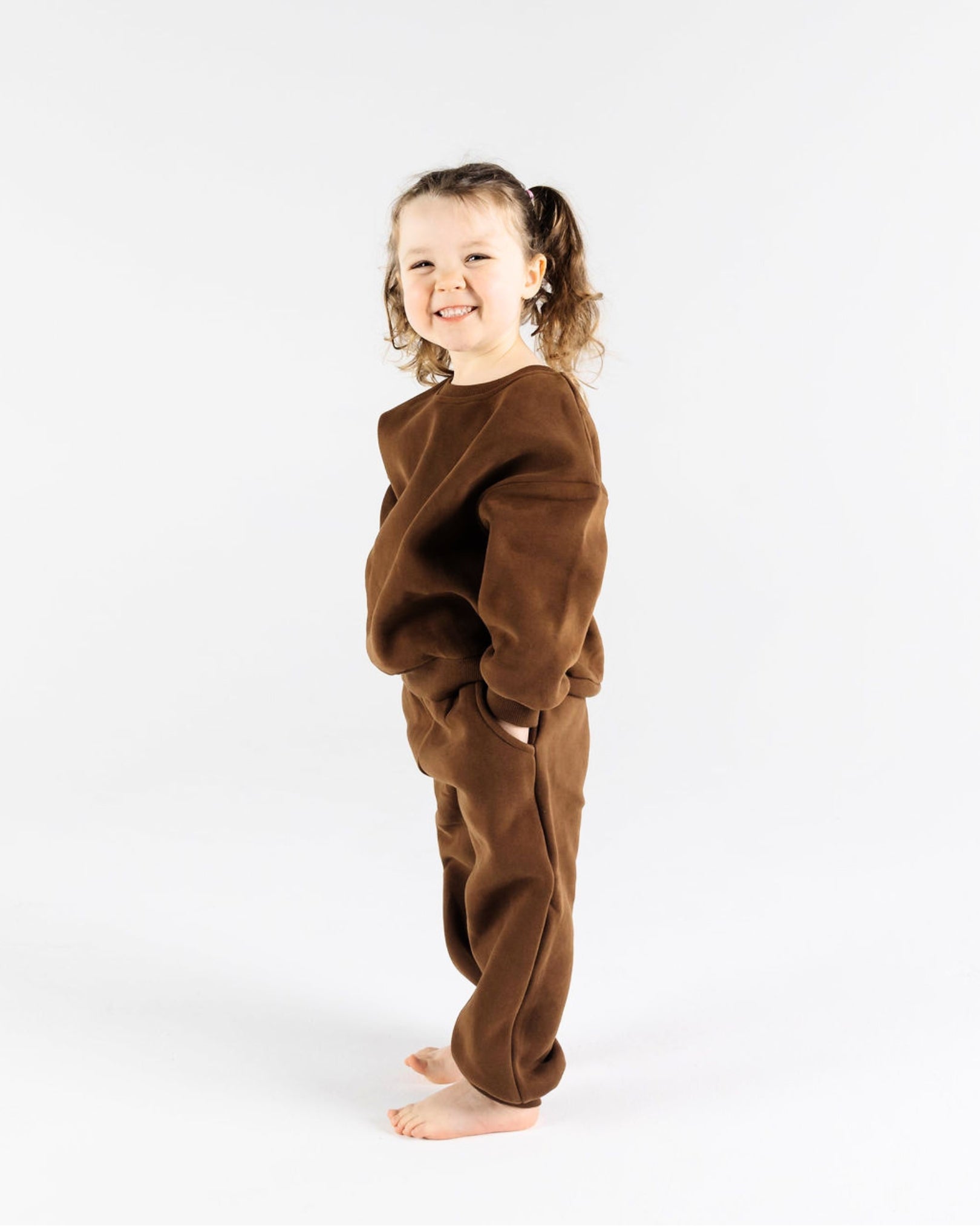 A young Happy kid in The Downtown Set - Chocolate Espresso