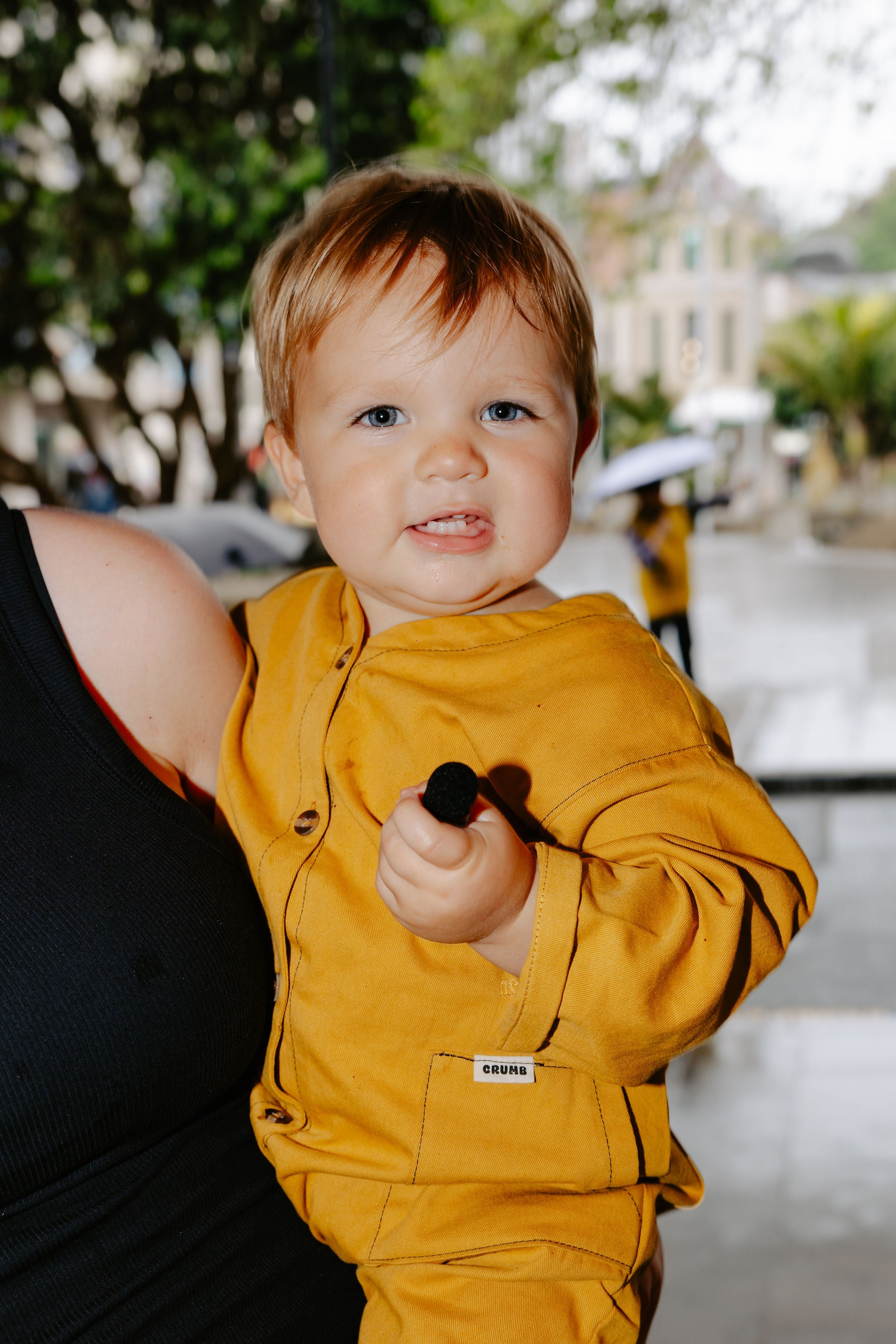 Child outdoors in our Honeycomb kids overall