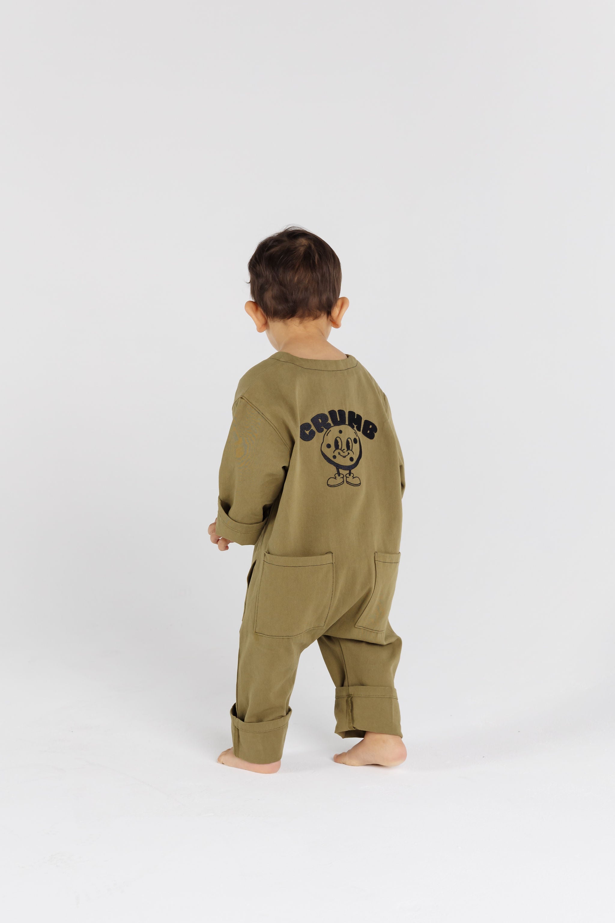 Child wearing Pistachio Overalls by Crumb