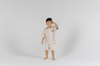 Happy kid in The Drop Sleeve Set - Milk