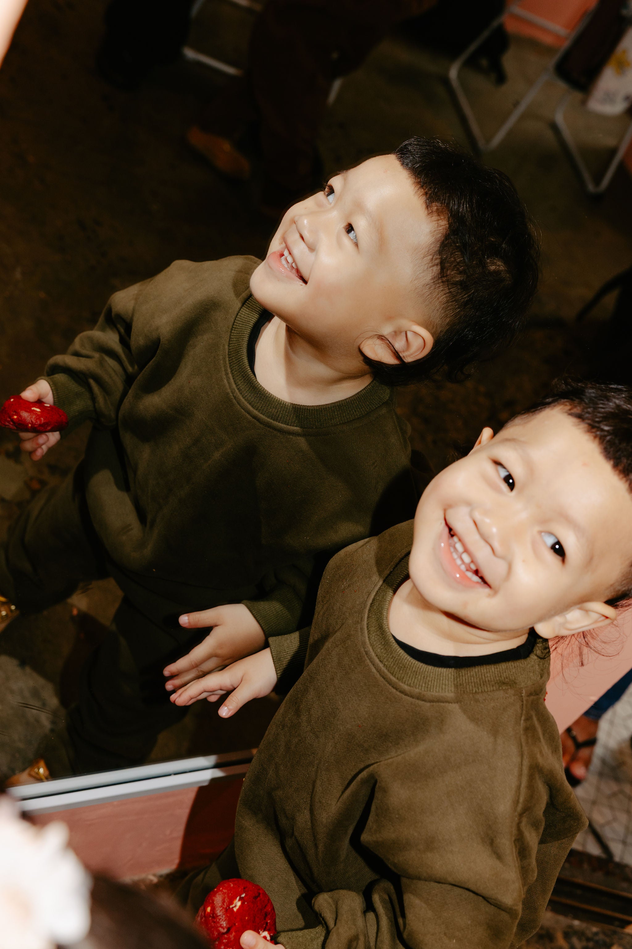 Happy kid wearing Downtown Set Pistachio Truffle kids tracksuit